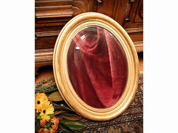 Small oval mirror with gilded molded frame