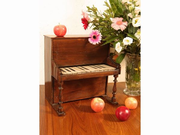 Small toy piano made of soft wood