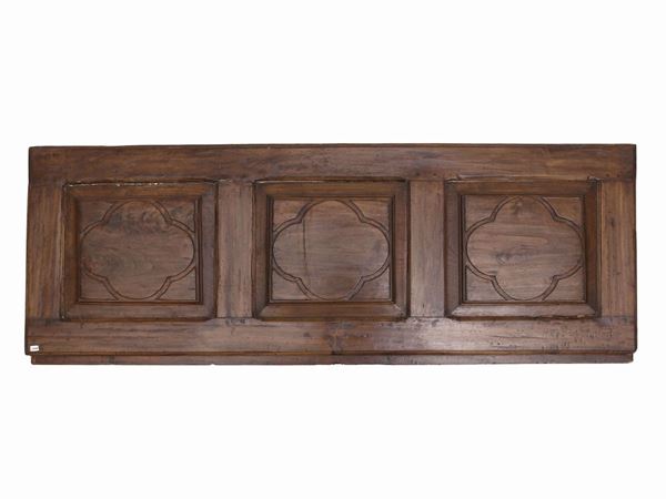Walnut panel carved with rosettes