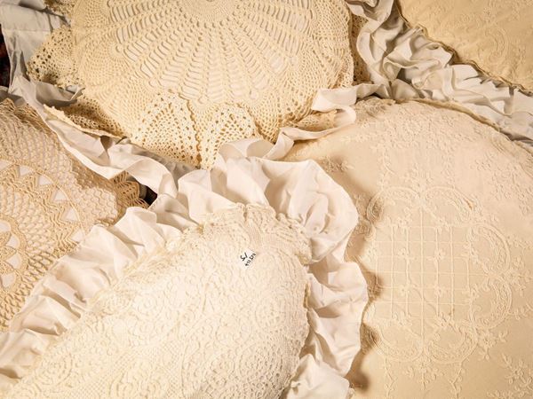 Five cushions with lace and crochet details