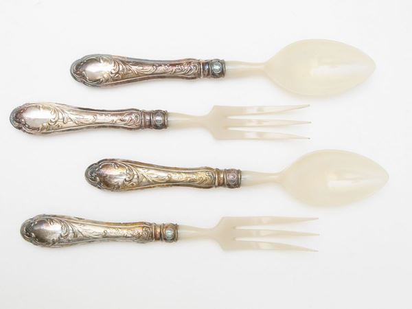 Serving cutlery set with silver coated handle