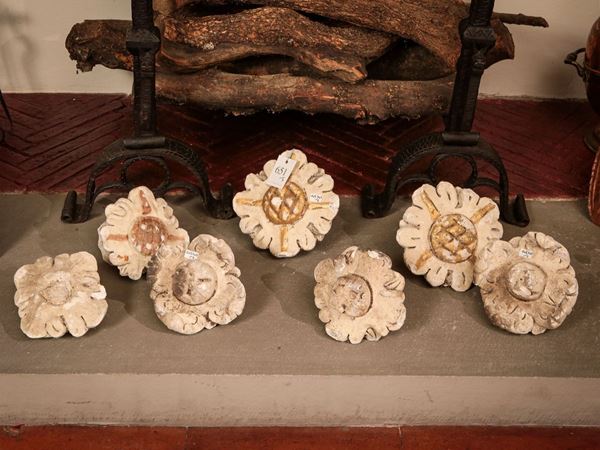 Seven plaster rosettes