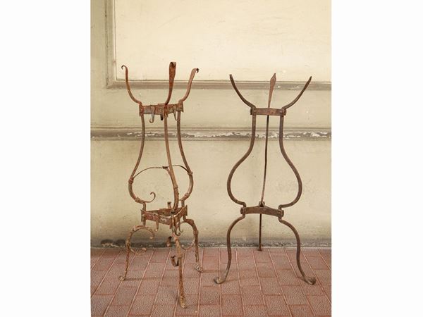 Two ancient wrought iron tripods