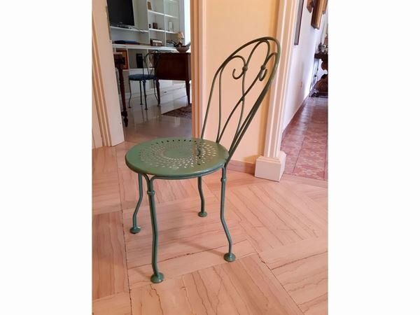 Set of four mint green wrought iron garden chairs