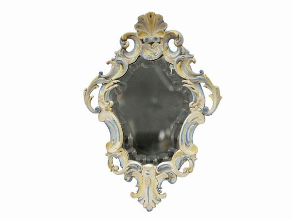 Small mirror in carved and lacquered wood