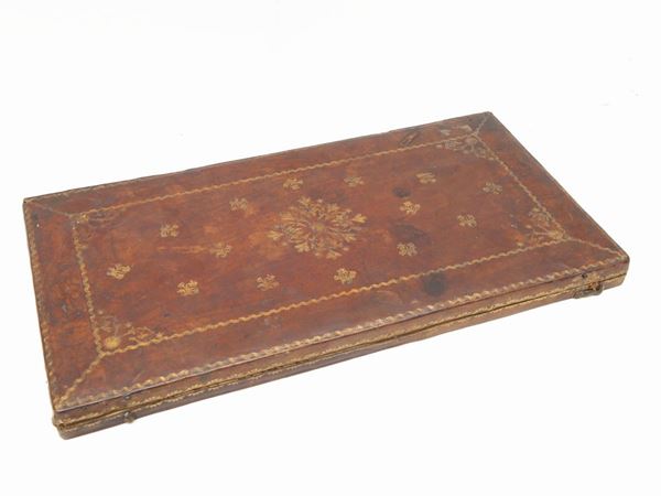Leather case embossed with bronze scientific instruments