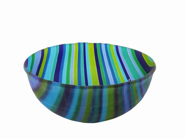 Striped glass bowl decorated with multicolored canes