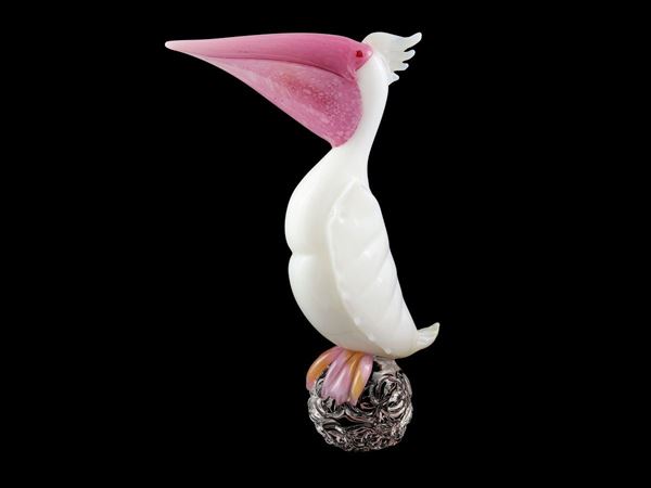 Sculpture depicting a pelican in thick milky glass
