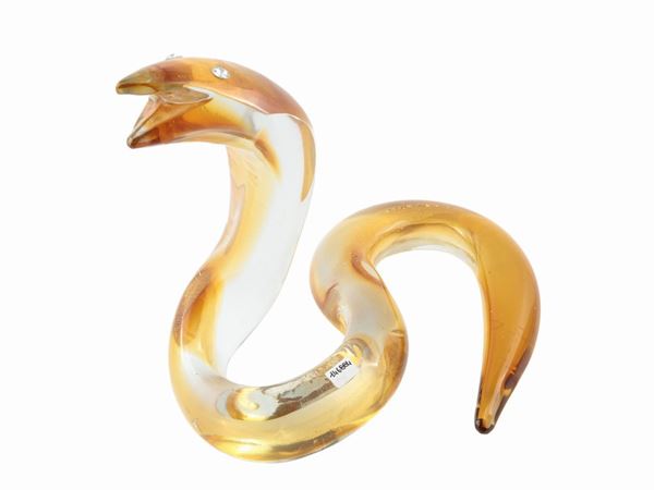 Snake in thick shaded ocher yellow glass