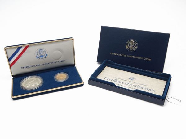 A set of 1 and 5 dollars in silver and gold