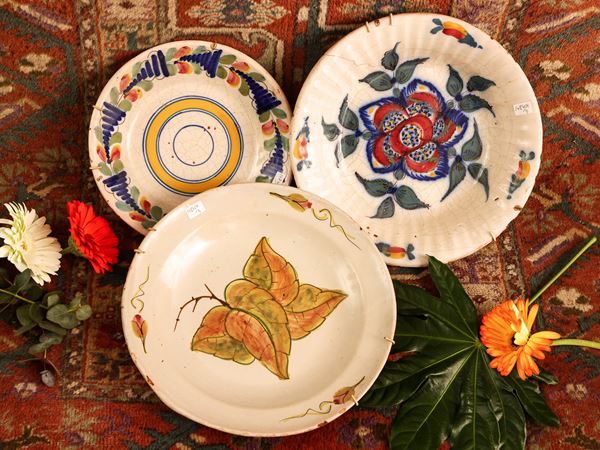Three plates in popular majolica