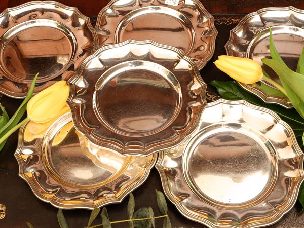 Set of eight silver saucers