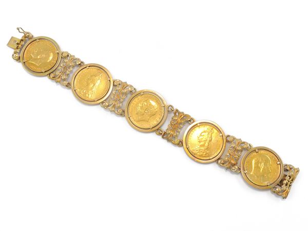 Bracciale in oro giallo con cinque monete da una sterlina