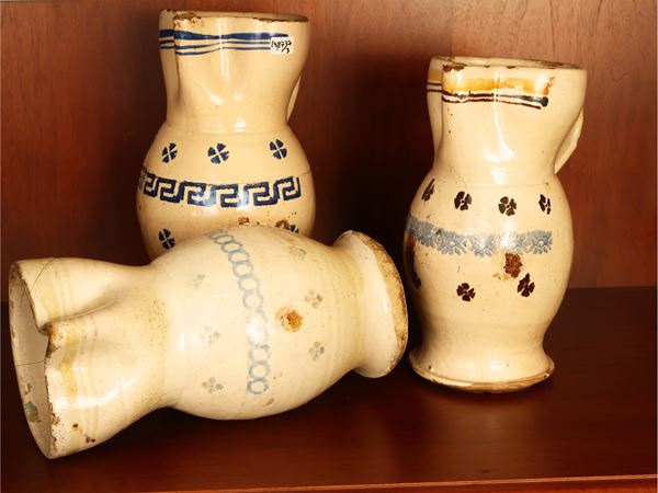 Three large jugs in popular majolica