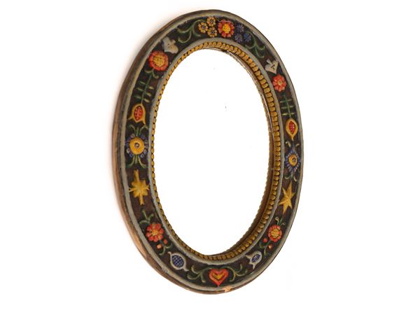 Oval mirror with glazed terracotta frame