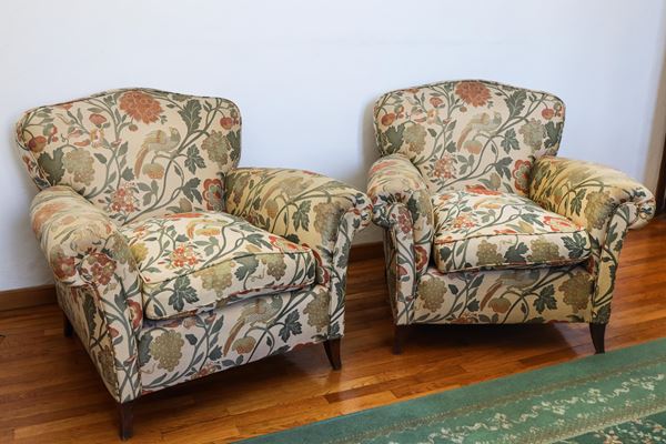 Pair of upholstered armchairs covered in floral fabric