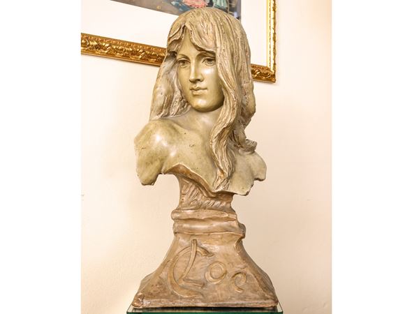 Bust of a girl in patinated terracotta