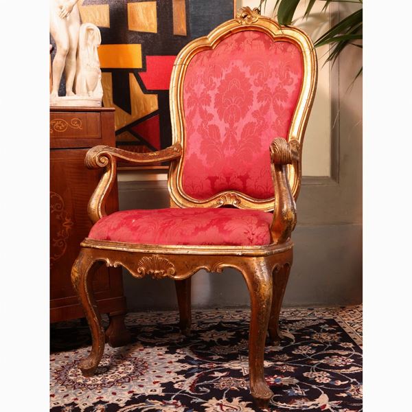 Armchair in carved and gilded wood