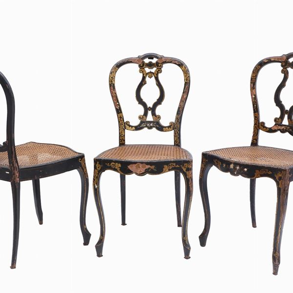 Series of three chairs in ebonized wood