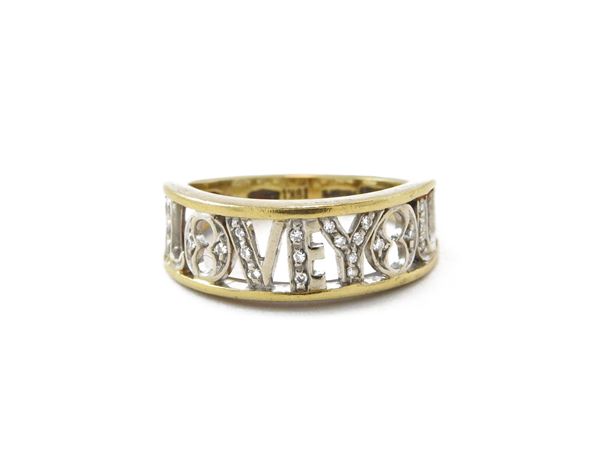 White and yellow gold band ring with diamonds