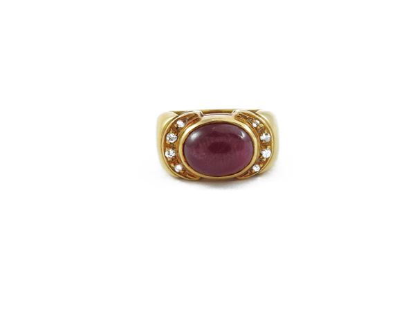 Yellow gold pinky ring with ruby and diamonds