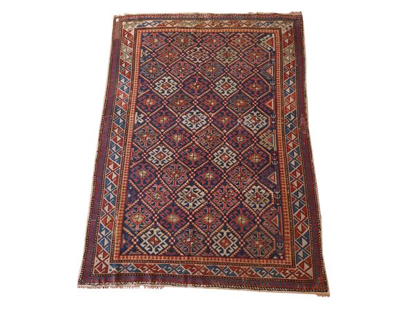 Small Caucasian carpet of old manufacture