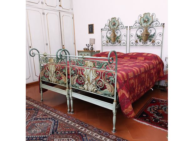 Pair of beds in water green lacquered and painted wrought iron