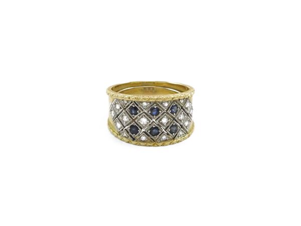 Band ring in yellow and white gold with diamonds and sapphires