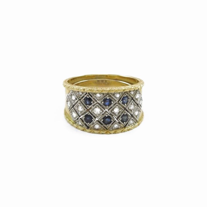 Anello a Fascia in Oro Bianco e Oro Giallo con Diamanti e Zaffiri