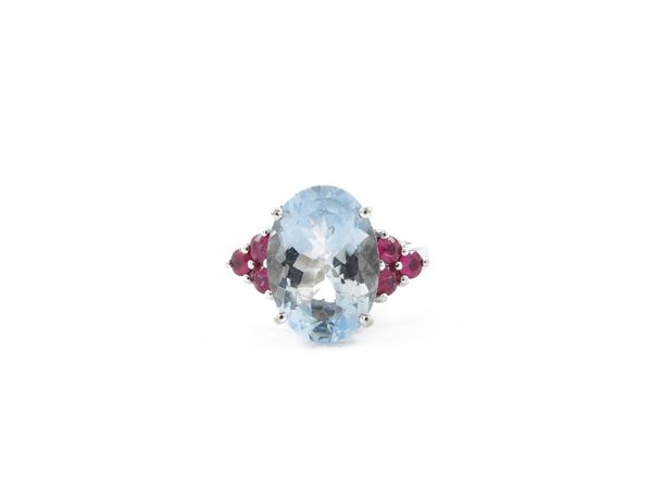 White gold ring with rubies and aquamarine