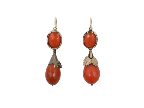 Low title gold pendant earrings with red orange coral