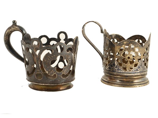 Two silver teacup holders