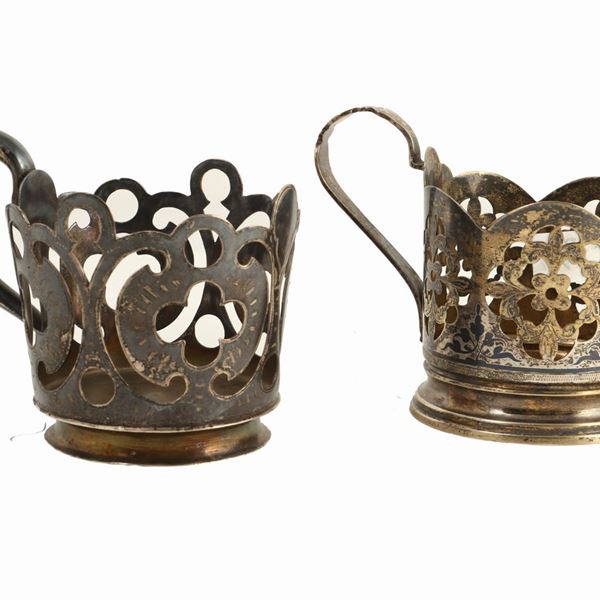 Two silver teacup holders