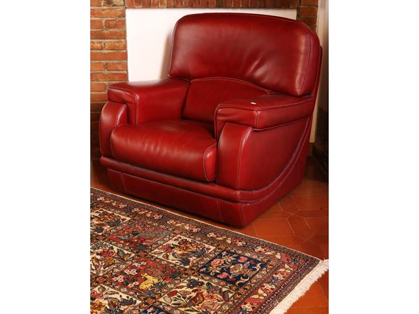 Large armchair upholstered in burgundy ecological leather