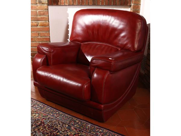 Large armchair upholstered in burgundy ecological leather
