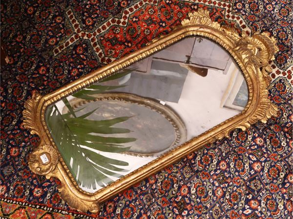 Small mirror with carved and gilded wooden frame