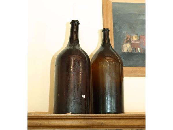 Pair of large glass bottles from Empoli