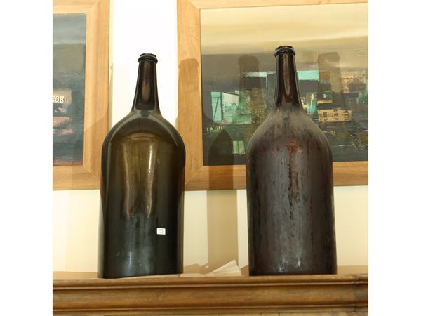 Pair of large glass bottles from Empoli