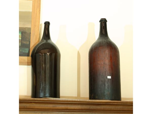 Pair of large glass bottles from Empoli