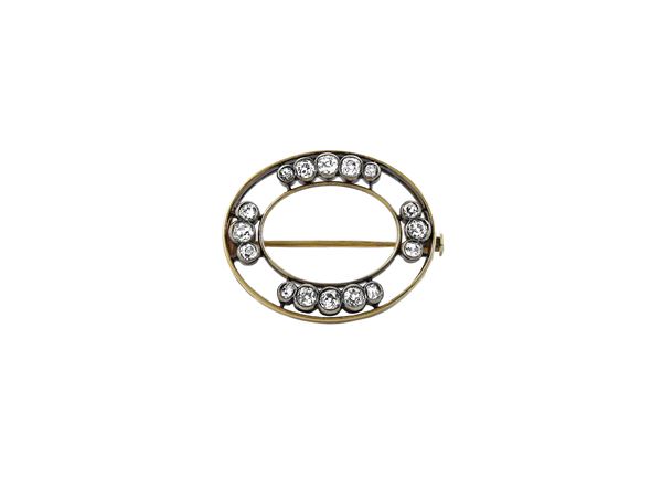 Yellow gold and silverbrooch with diamonds