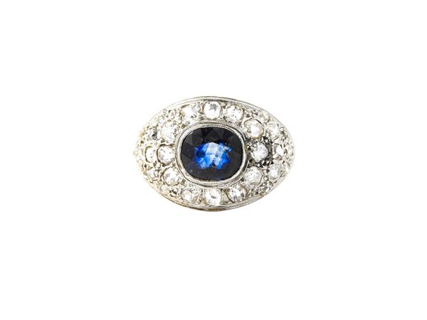 Yellow gold and silver ring with diamonds and sapphire