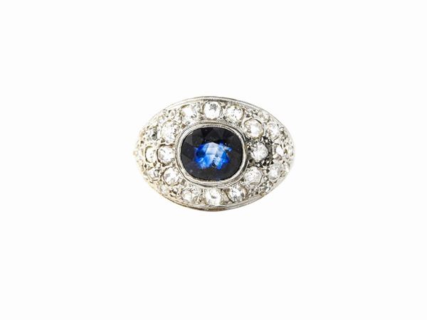 Yellow gold and silver ring with diamonds and sapphire