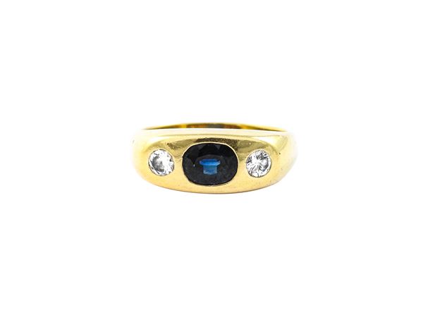 Yellow gold band ring with diamonds and sapphire