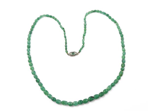 Emerald necklace with gold and silver clasp with diamonds and emerald