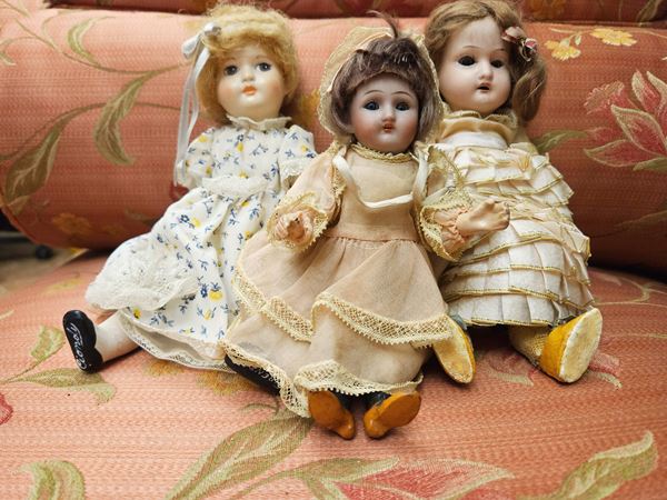 Tre bamboline con testa in biscuit
