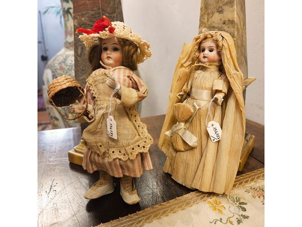 Two dolls with biscuit heads