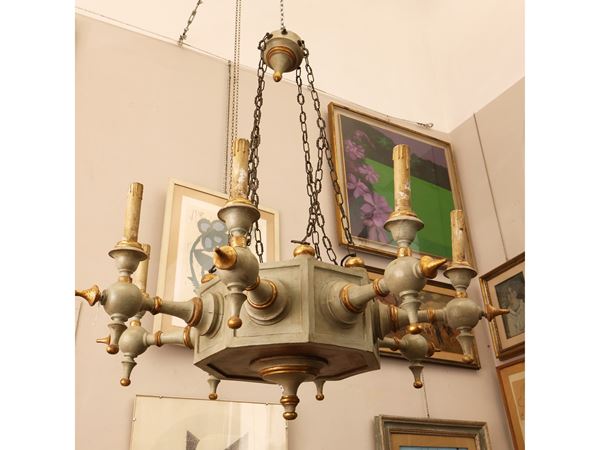 Carved wooden chandelier, lacquered and highlighted in gold