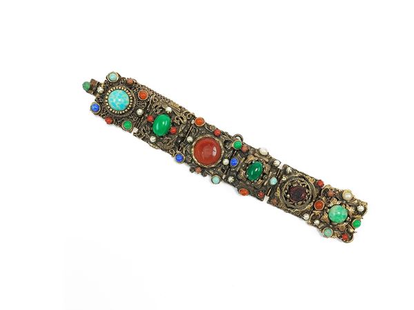 Bracelet in worked metal, semiprecious stones and simulated pearls