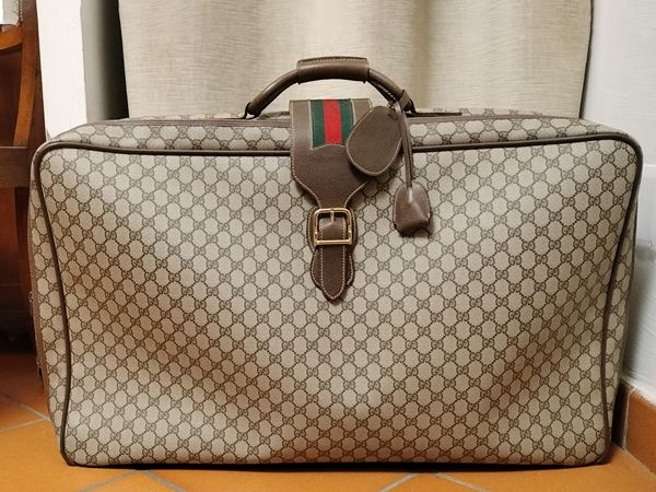 Gucci, Soft suitcase in waterproofed GG monogram canvas