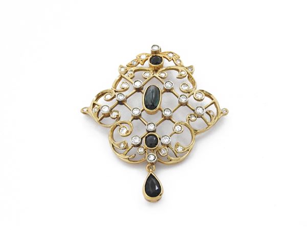 Yellow gold pendant with diamonds and sapphires